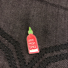 add more spice sriracha enamel pin on denim