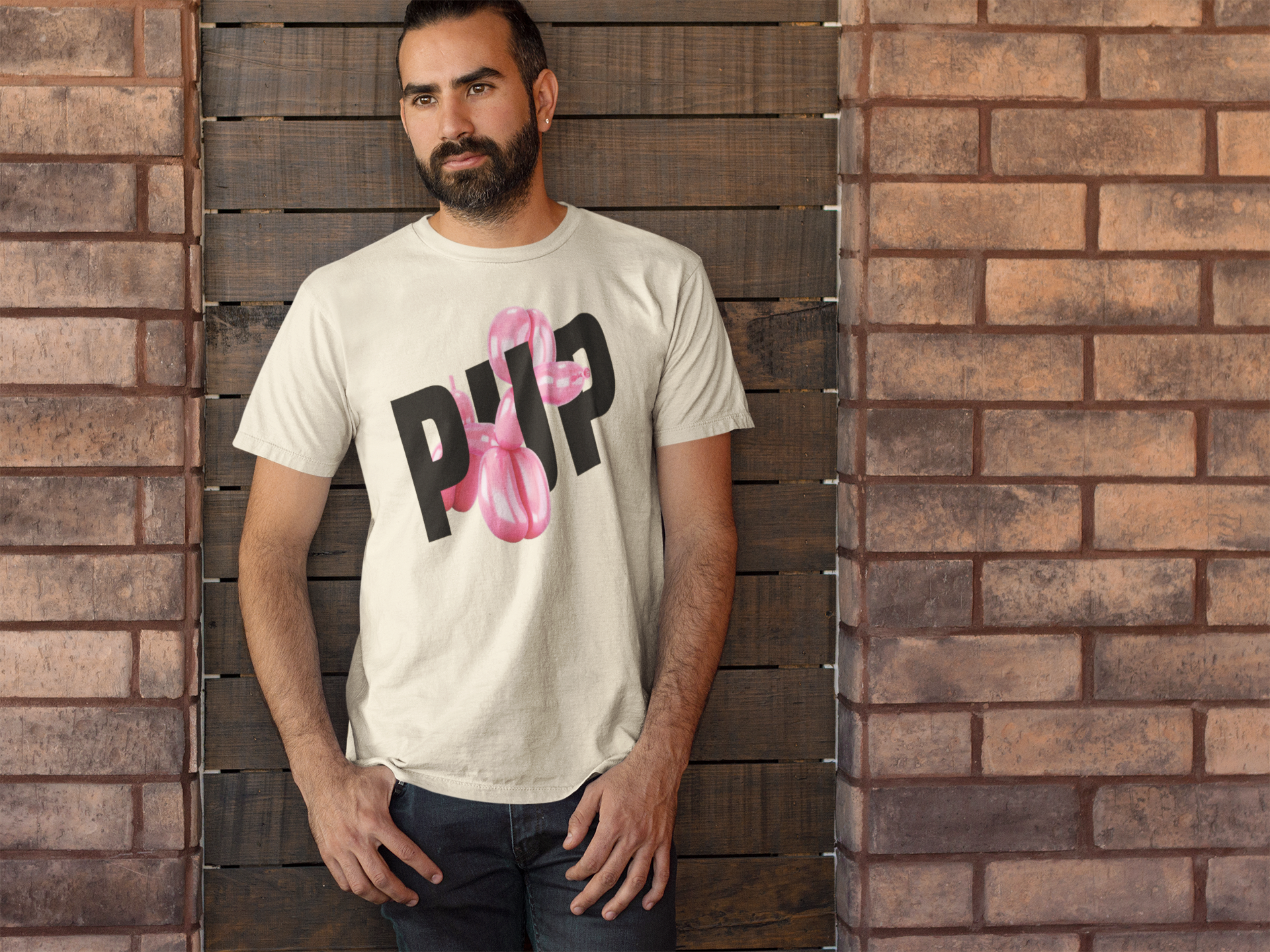 handsome man wearing a Jeff Koon's inspired gay puppy play tshirt
